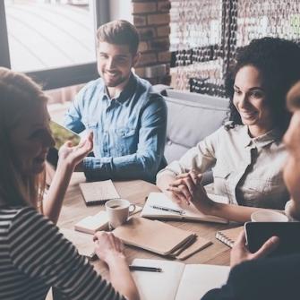 smiling team members in meeting